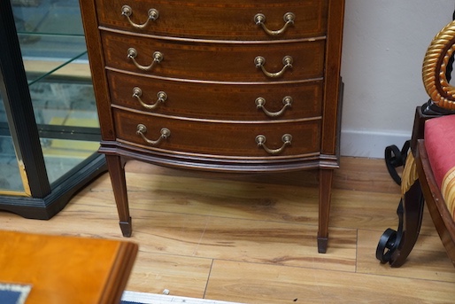 An Edwardian satinwood banded mahogany bowfront sheet music cabinet, width 61cm, depth 44cm, height 143cm